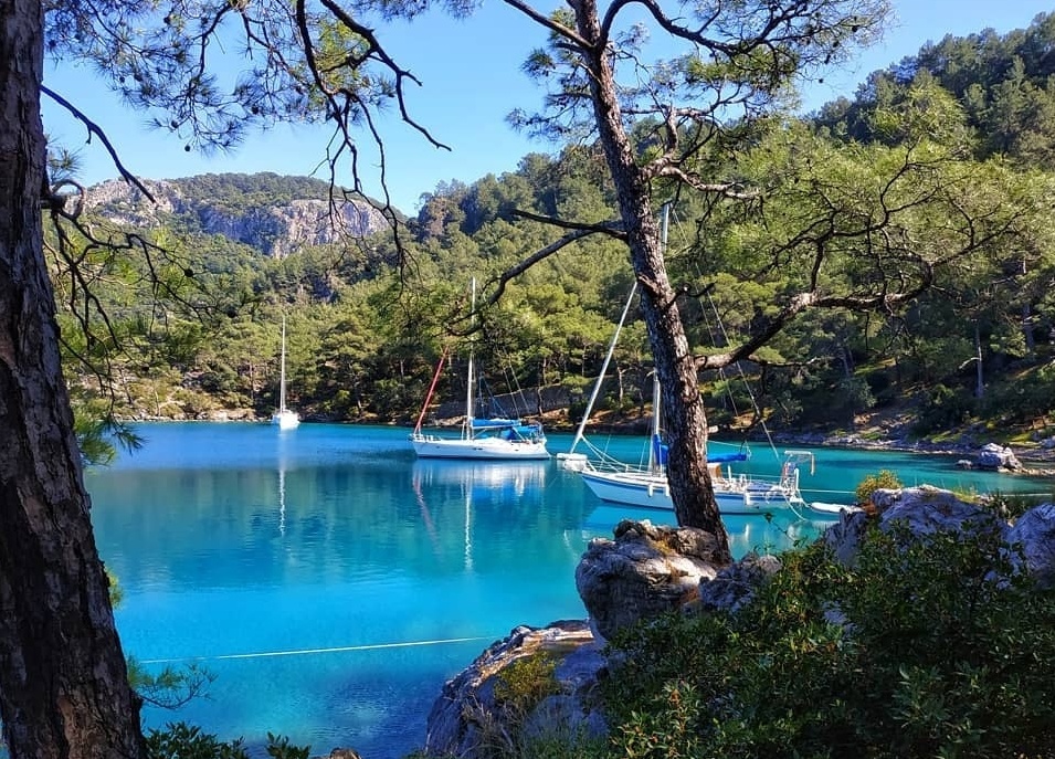 The sheer rock wall and deep clear water of Wall Bay (Duvar Koyu) near Göcek